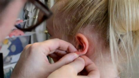 Painless Ear Piercing By Needle Youtube