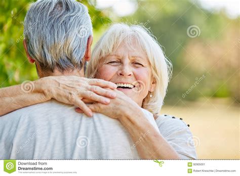 Smiling Senior Woman Hugging A Man Stock Image Image Of Park Fall