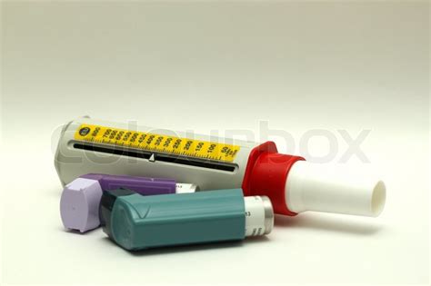 Never choose the wrong color again. Peak flow meter and two asthma inhalers | Stock Photo | Colourbox