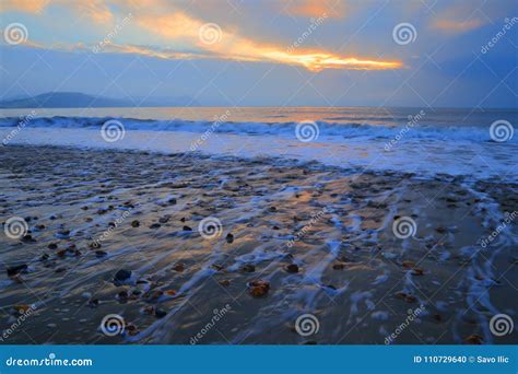 Blurred Waves At Sunrise On The Beach Stock Photo Image Of Water