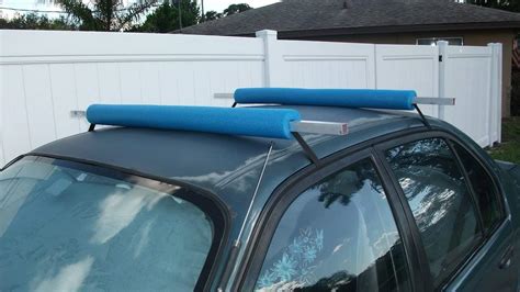 Now that you've secured the pool noodles, it's time to put the kayak on the roof. How to Transport a Kayak Without a Roof Rack - Kayak Help