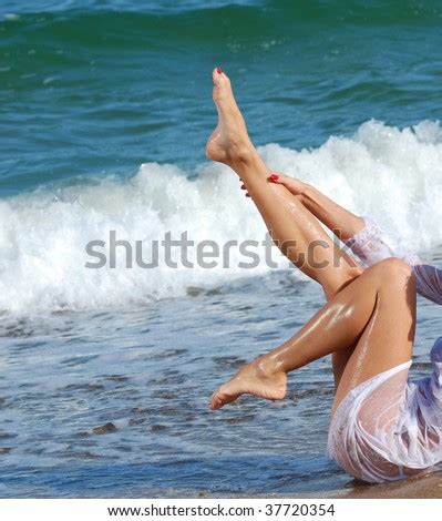 Tan Legs On A Tropical Beach Stock Photo Shutterstock