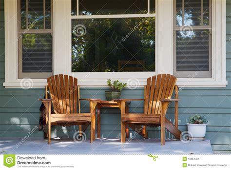 Country cottage style furniture begins with porch furniture. Two Adirondack Chairs Porch Stock Image - Image of ...