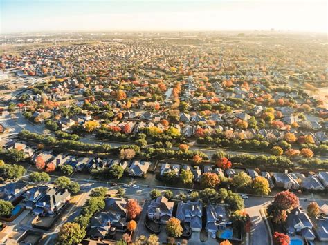 Top View Residential Neighborhood And Sprawl In Autumn Season In North