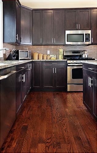 Think about why you love the idea of wood floor in your kitchen. Pros and Cons of Hardwood Flooring in the Kitchen