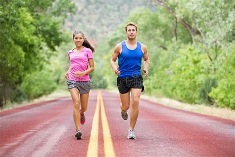 Running Young Couple Outside Jogging Happy Smiling Stock Photo Image