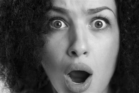Black And White Close Up Of A Frightened Astonished Woman With W