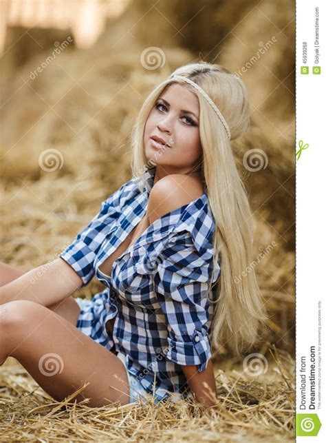 Sexy Blonde Woman Resting On Hay In Rural Areas Stock Photo Image