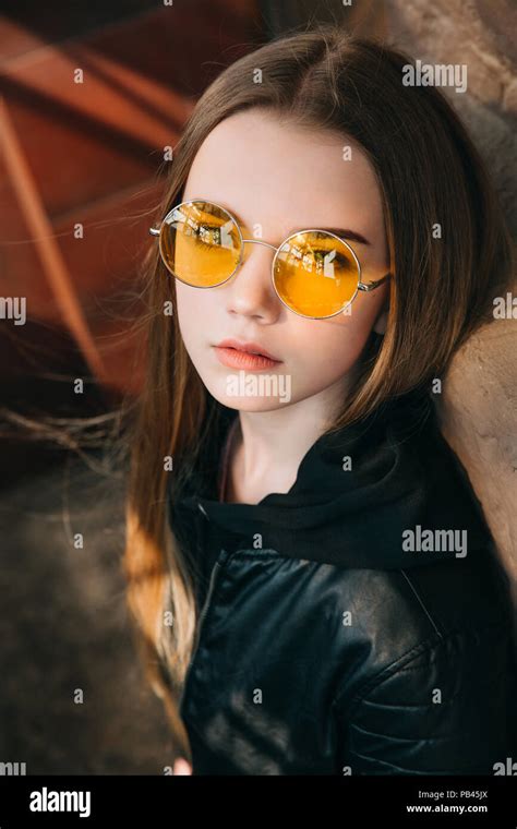 Beautiful Fashionable Teenager Girl With Long Hair In Yellow Sunglasses