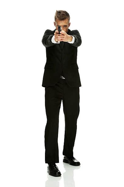 Royalty Free Man Pointing Gun Suit Full Body Pictures Images And Stock