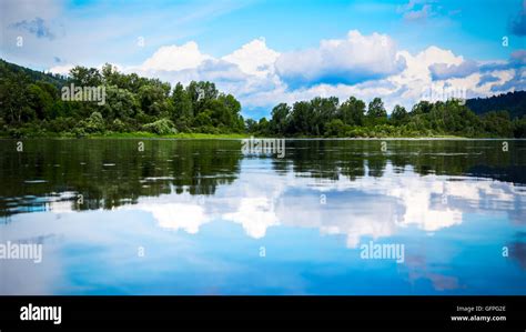 Beautiful Landscape Panorama With Cloudy Blue Sky Reflected In The