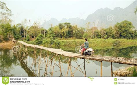 Cheerful Tourist Crossing Bamboo Bridge Motorbike, Limestone View, Laos ...