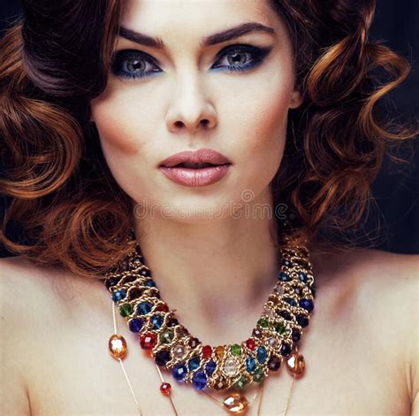 Beauty Rich Woman With Bright Makeup Wearing Luxury Jewellery On Black