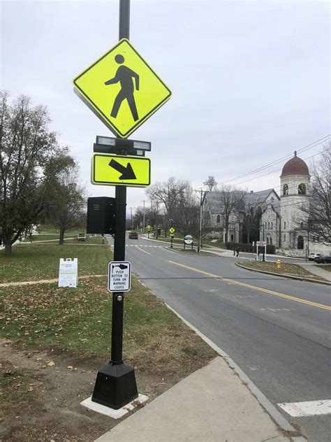Town Installs New Pedestrian Crossing Lights Signs Along Main Street