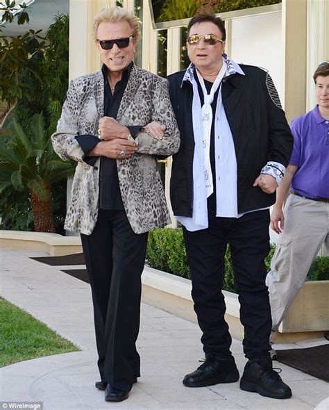 Siegfried & roy also wowed audiences with a giant mechanical dragon. Siegfried helps Roy feed a cub as magicians emerge for ...