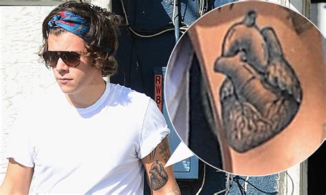 One Directions Harry Styles Unveils Graphic New Heart Tattoo On His