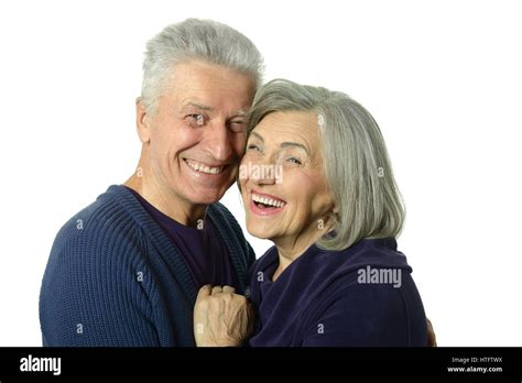 Portrait Of A Happy Old Couple Embracing On A White Background Stock