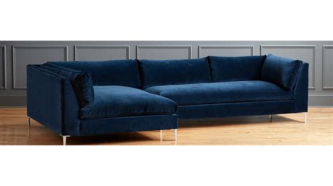 A blue sofa will make a striking addition to any modern living space. Decker 2-Piece Blue Velvet Sectional Sofa + Reviews | CB2