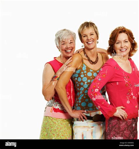 Portrait Of Three Mature Women Standing Together And Smiling Stock