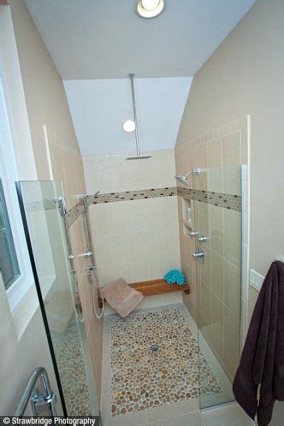 A Beautiful Custom Tiled Curbless Shower Stall With A Teak Bench
