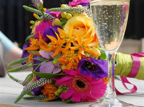 Perfect for an outdoor fall wedding, this bouquet features an assortment of wildflowers, roses, lilies, wallflowers, and hypericum berries in pretty autumn these substantial flowers last about two weeks after cutting and easily stand up to tousling. 35 Beach Wedding Bouquets - Destination Wedding Details