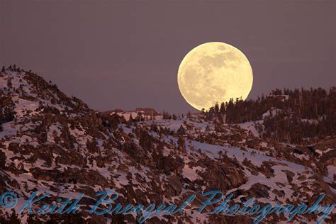 Full Wolf Moon Rise Over The Snow Covered California Sierra Nevada