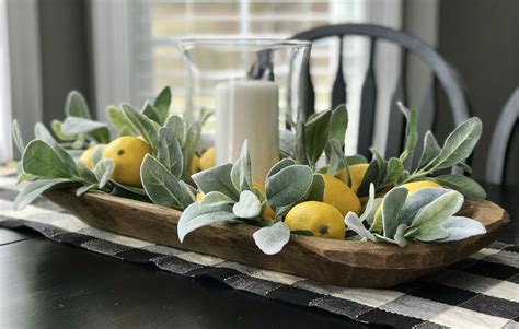 A dough bowl is the perfect container to use for a fall centerpiece. Summer dough bowl centerpiece with lemons and lambs ear. | Farmhouse table centerpieces, Spring ...