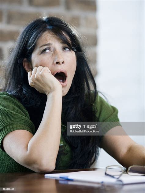Woman Yawning At Work High Res Stock Photo Getty Images