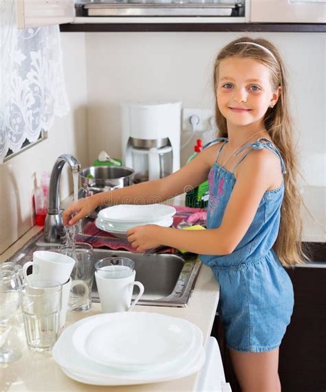 Girl Doing Dishes At Kitchen Stock Photo Image
