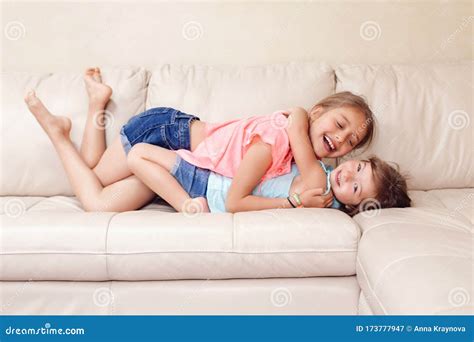 Two Cute Little Caucasian Girls Siblings Playing At Home Adorable
