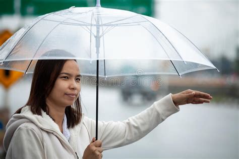 Asian Woman Holding Umbrella Hitchhiking Taxi At City Street In Rainy Day Stock Image Image Of