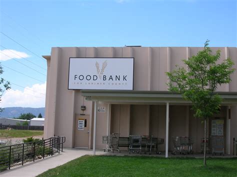 Lauren rhoades, the program director for food bank for larimer county, hands out bags of food to a motorist as they serve children lunches throughout the coronavirus pandemic at bauder elementary. History of the Food Bank for Larimer County