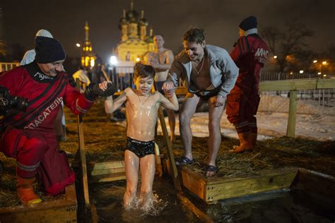 Russians Plunge Into Icy Waters To Mark Feast Of Epiphany