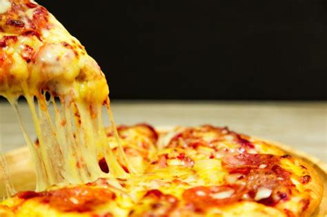 Premium Photo Very Cheesy Pizza Slice In Hand Hot Pizza Slice With Melting Cheese Queijo