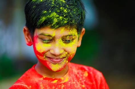 Premium Photo Holi Celebrations Indian Little Boy Playing Holi And