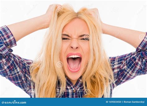 Close Up Portrait Of Angry Woman Screaming And Holding Head Stock Photo