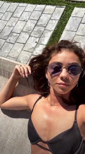 sarah hyland sunbathes in cupped bikini poolside to kick off the weekend