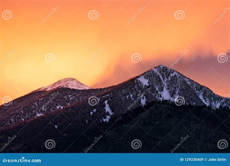 Colorful Sunset Sky Over Snow Capped Mountains In Flagstaff Arizona