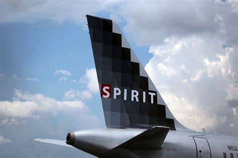 spirit airlines flight diverted to denver after passenger attempted to open door in midair the