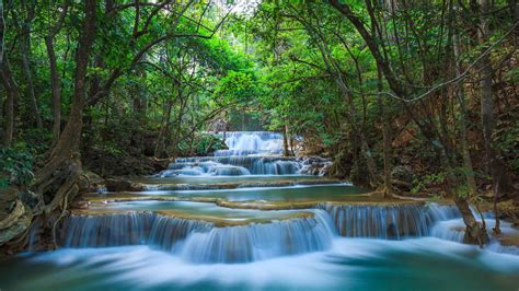 A waterfall is defined as a place where water flows over a vertical drop in the path of a river or stream. Green Nature River Cascade Waterfall Kanchanaburi Thailand ...