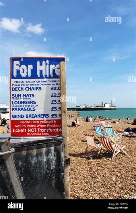 Brighton Beach With Deckchair For Hire Sign And Prices East Sussex