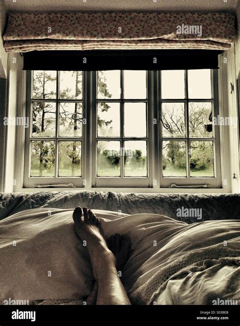 Lazy Sunday Morning In Bed Looking Out Of The Window Stock Photo Alamy
