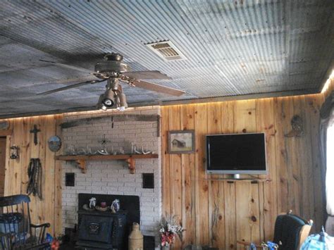 The use of ceiling details was one way that homes were given extra individuality. Galvanized tin ceiling rustic decor wood board walls rope ...