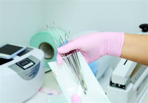Dental Instrument Packaging In A Sterilization Baga Medical Worker