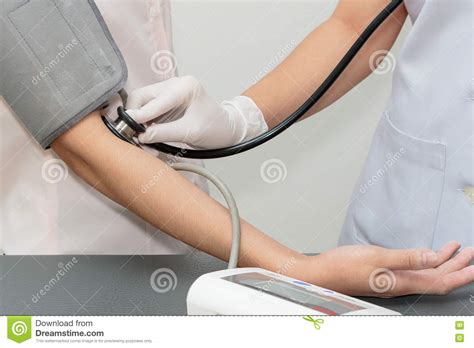 Doctor And Patient Measurement Of Blood Pressure Stock Photo Image