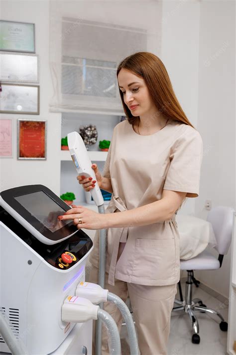Premium Photo Beautician Holding Ultrasound Device For Face And Skin
