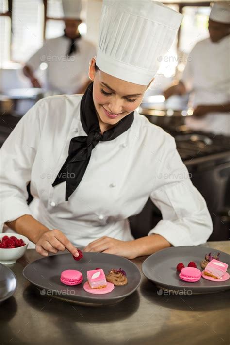 Smiling Female Chef Finishing Dessert Plates Artofit