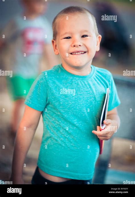 Outdoor Portrait Of Cute Little Smiling Boy Stock Photo Alamy