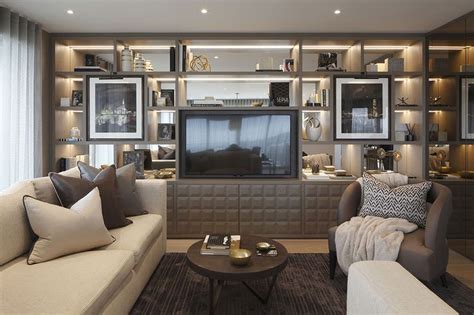 A Living Room Filled With Furniture And A Flat Screen Tv Mounted On A