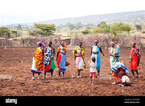 Maasai Women With Childrens Wearing Traditional Attire In A Maasai